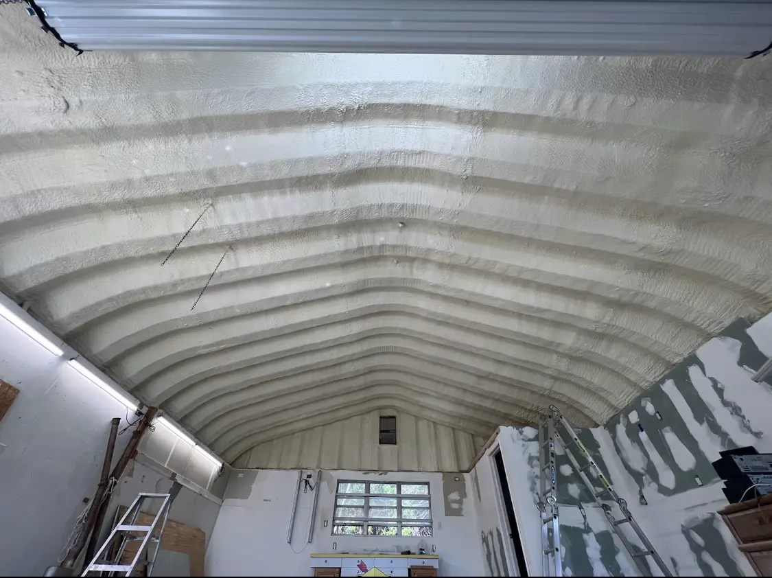 Spray polyurethane foam applied to the underside of a metal roof deck in Fitzgerald